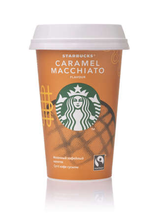 Samara, Russia - June 2021. Paper cup of Starbucks Caramel Macchiato cold coffee  isolated on whiteのeditorial素材