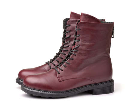 Side view of maroon leather winter ladies boots isolated on white