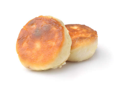Two quark pancakes syrniki isolated on whiteの写真素材