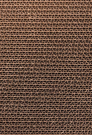 Close up of stacked brown corrugated cardboard texture. Side viewの写真素材