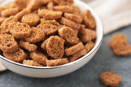 Close up of baked rye croutons on ceramic bowl