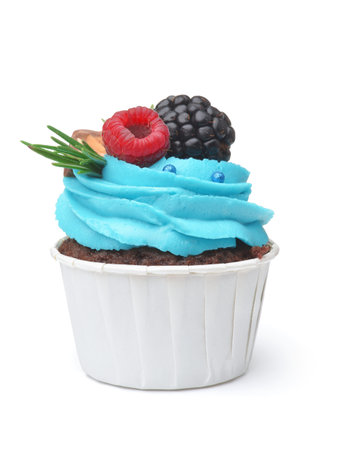 Front view of cupcake  with fresh  berries and cream isolated on whiteの写真素材