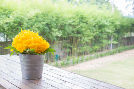 beautiful yellow flower bouquet on table in the gardenの写真素材