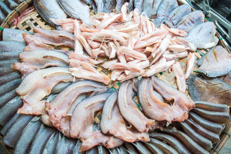 dried fish display many kind of fish such as gourami,sanke head fishの写真素材