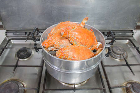 crab cooking by stream potの写真素材