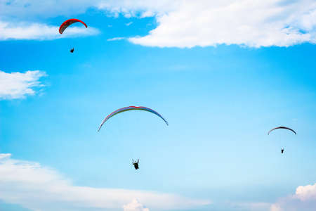 Paragliding in the blue skyの写真素材