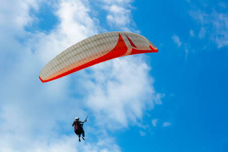 Paragliding in the blue skyの写真素材