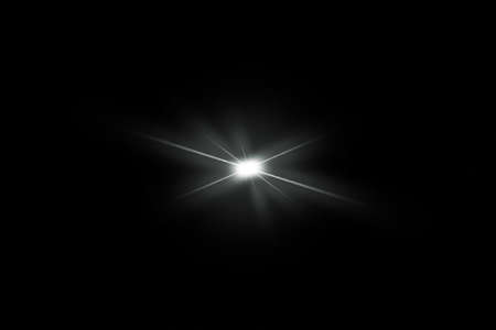 Digital lens flare, sun burst on black background.の写真素材