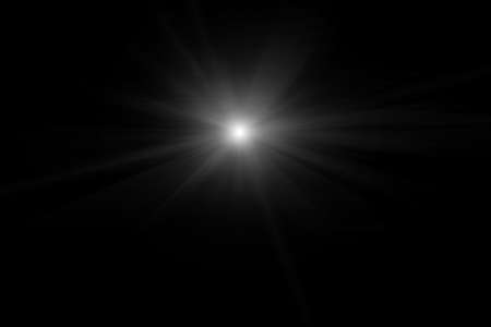 Digital lens flare, sun burst on black background.の写真素材