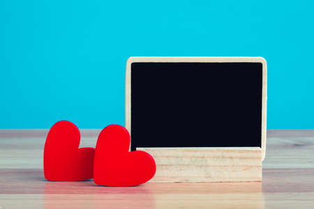 hearts and label on a wooden background,Valentine's Dayの写真素材