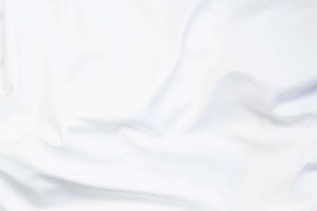 White fabric texture that is white cloth surface background with beautiful soft blur pattern.
