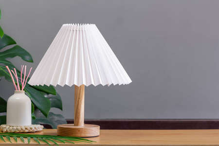 Minimal lamp on wood table.concept copy space.の写真素材