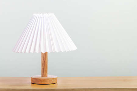Minimal lamp on wood table.concept copy space.の写真素材