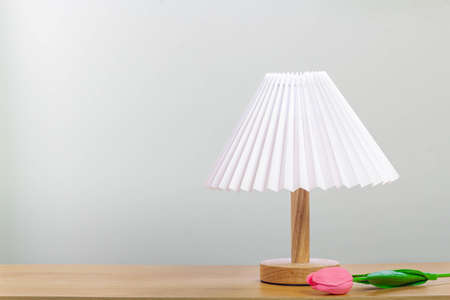Minimal lamp on wood table.concept copy space.の写真素材