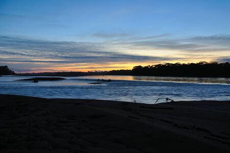 Sunrise on the Tambopata River in Peruの写真素材