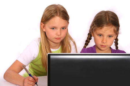 Two girls are learning with computerの写真素材