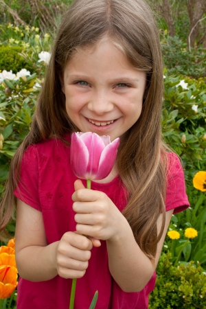 girl with pink tulipの写真素材