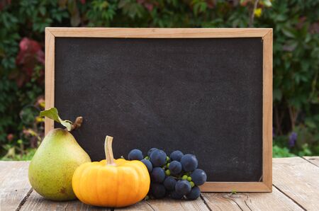 blackboard with fruitsの写真素材