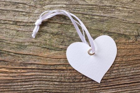 white heart on wooden groundの写真素材