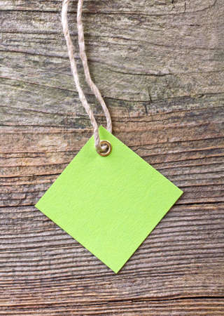 green label on wooden groundの写真素材