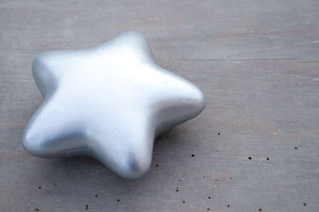 silver star on wooden groundの写真素材