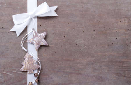 Bells, label and white loop on wooden groundの写真素材