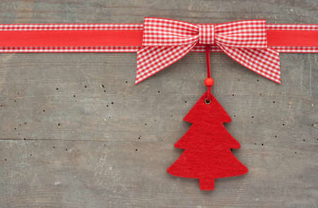 checked loop and christmas tree on wooden groundの写真素材