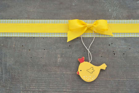 yellow loop and hen on wooden groundの写真素材