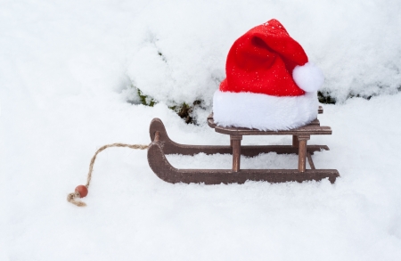 santa hat and carriage in snow