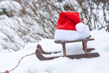 santa hat and carriage in snowの写真素材