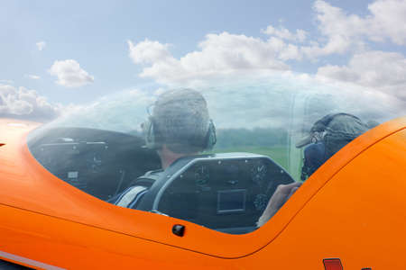 detail of orange plane and blue skyの写真素材