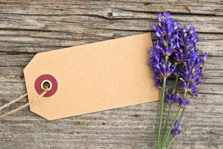 Lavender with label on wooden ground