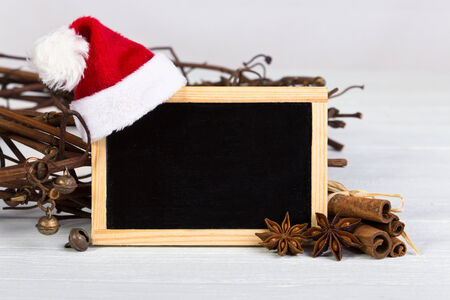 Chalkboard with santa hat ans anise cinnamonの写真素材