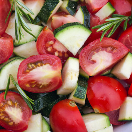 Fresh tomatoes, zucchini and rosemaryの写真素材