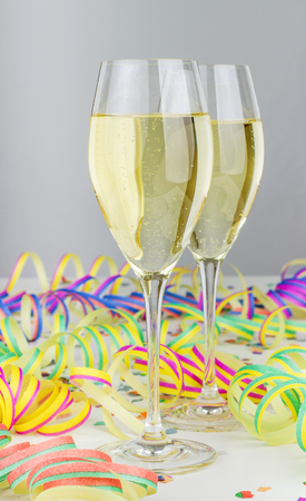 Champagne glasses, streamers and confettiの写真素材