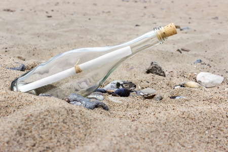Message in a Bottle on the sandy beachの写真素材