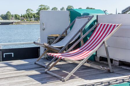 Two deck chairs on the ship's deck