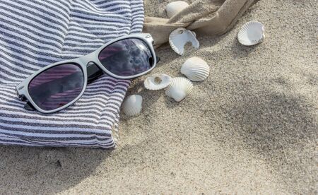 Beach bag, has on the sandy beachの写真素材