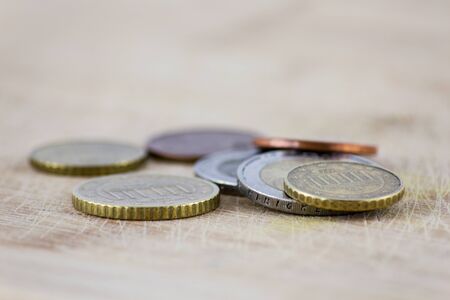 Euro coins on a wooden backgroundの写真素材