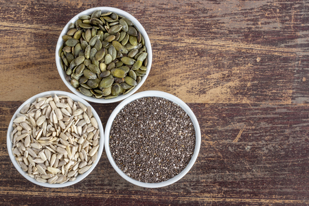 Three porcelain nuts with different seedsの写真素材