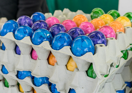Cardboard box with colored Easter eggs