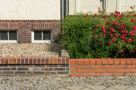 Two front gardens with and without plants in summerの写真素材