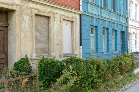Detailed view of an old and a renovated house facadeの写真素材