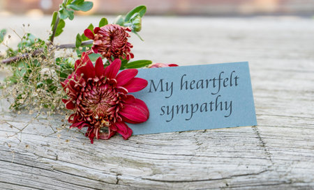 Condolence card with dark red chrysanthemums and English text: My heartfelt sympathyの写真素材