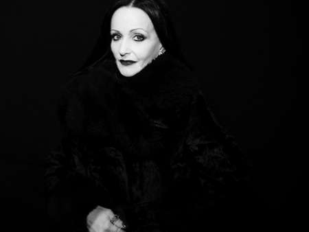 Portrait of a mature woman in a fur coatの写真素材