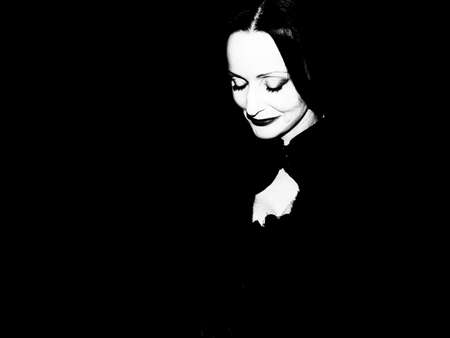 A portrait of a striking older woman on black.の写真素材