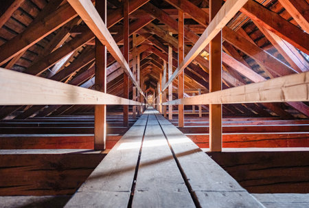 Interior of a wooden building with wooden beams in the attic.の写真素材