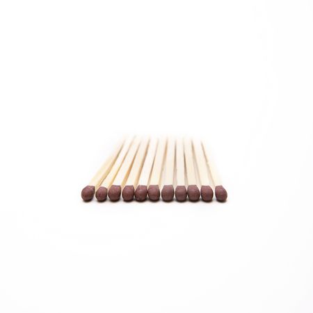 Matches unlit on a white surfaceの写真素材