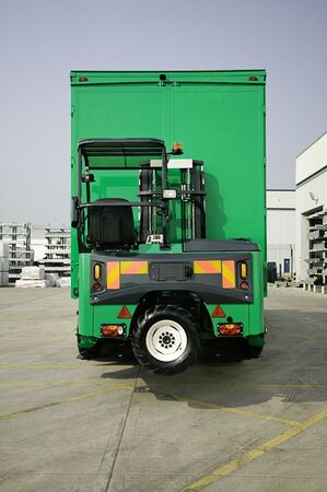 Moffett Truck Mounted Forklift in opperation at depotの写真素材