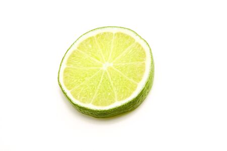 lime in sclices on a white backgroundの写真素材
